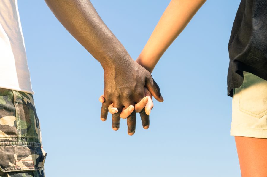 Interracial Dating Couple Holding Hands